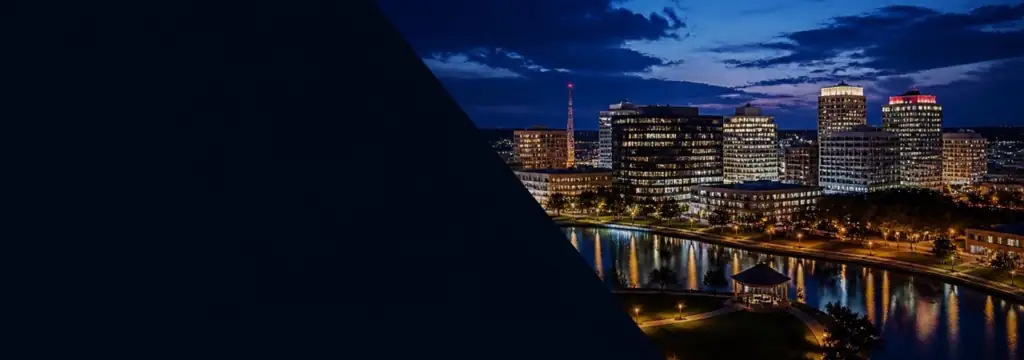 Huntsville, Alabama skyline at night representing The Devela Group's headquarters and business growth.